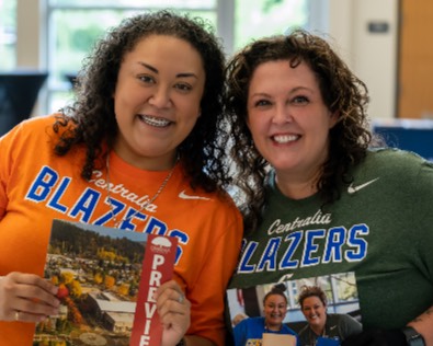 Two Centralia College staffers smile at the 2024 registration events