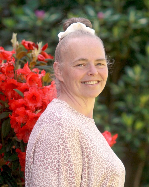 This is a photo of Nikki Sprague taken in the spring near the campus library