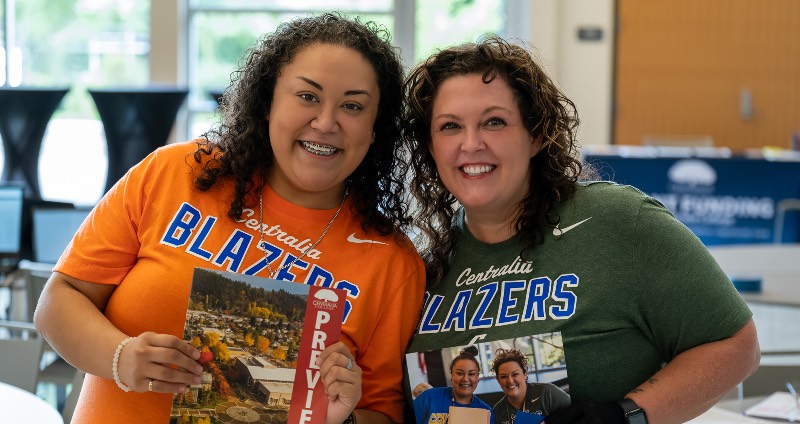 A photo of two members of the centralia College staff at an on-campus registration event